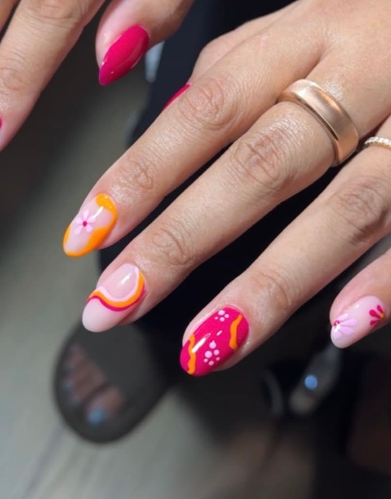 Almond nails with magenta, orange and pink swirl and daisy artwork