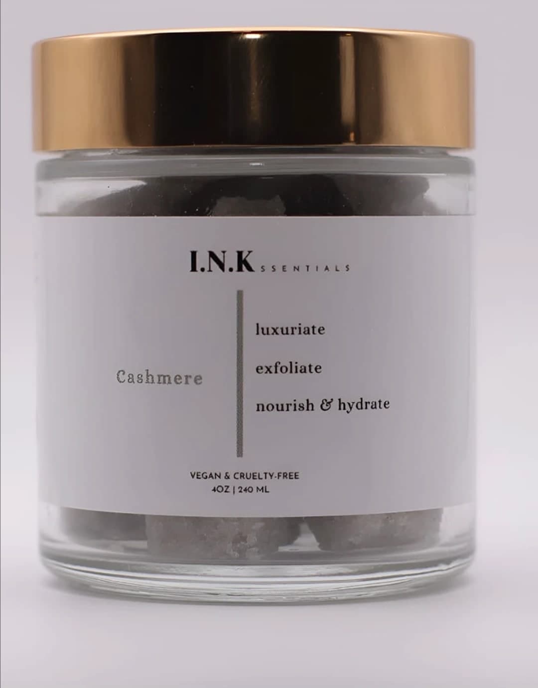 A jar of I.N.K.ssentials Cashmere vegan sugar scrub cubes with a gold lid — luxuriate, exfoliate, nourish & hydrate, 4 oz / 240 ml